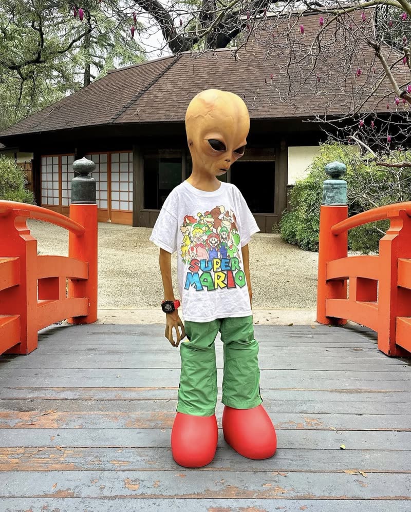 Lil Mayo on a garden bridge